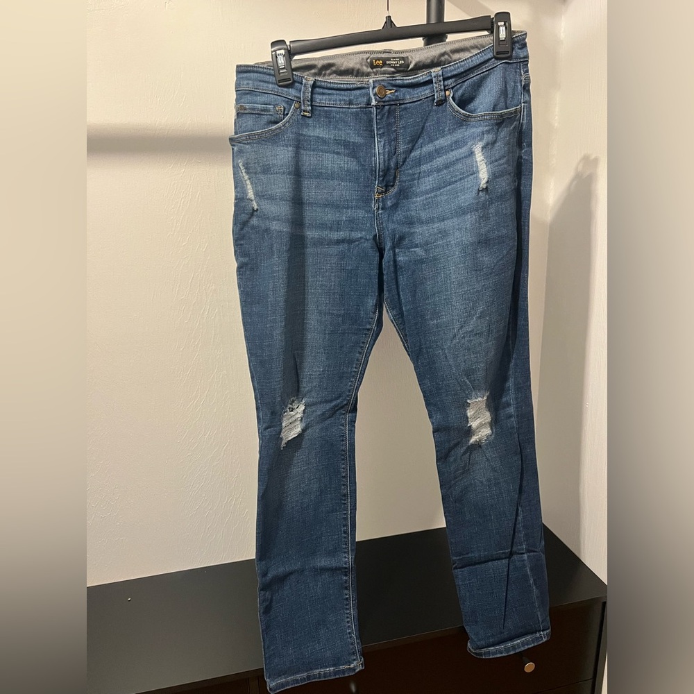 Woman’s Blue Distressed Jeans